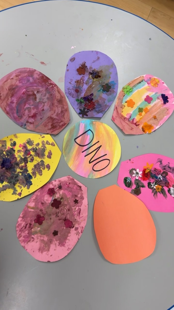 Collaborative preschool flower collage made with painted paper petals